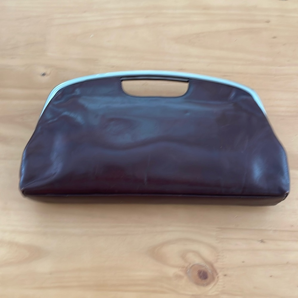 HOBO INTERNATIONAL dark brown clutch with metal handle